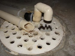 Water softener discharge at floor drain