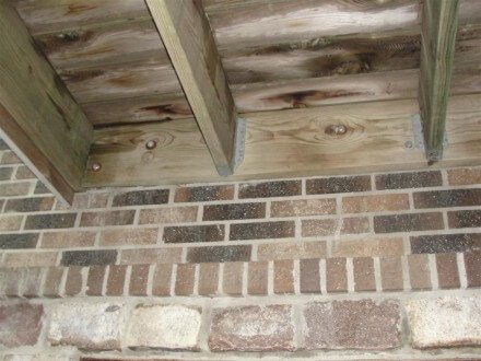 Deck attached to brick veneer