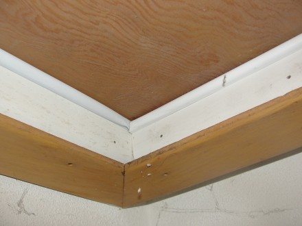 Weatherstripping at attic access panel