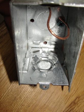 Knockout plug inside view with tabs bent