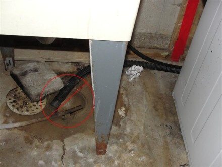 Sump pump discharge into floor drain