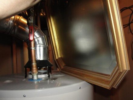 Mirror at backdrafting water heater