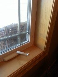 Vinyl window with maple trim