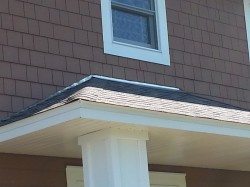 Aluminum flashing from roof line to Hardie shake