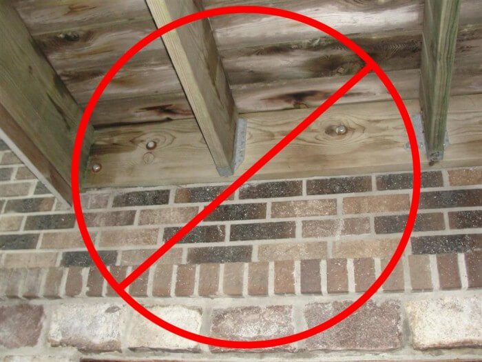 No deck attachment through brick veneer