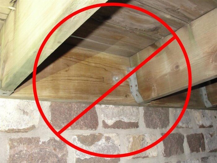 No deck attachment through stone veneer