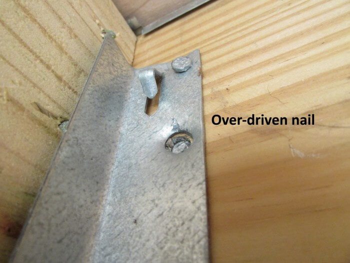 Exterior - overdriven nails at joist hanger marked up